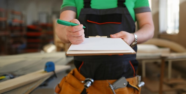arms-worker-offer-clipboard-with-green-pen_151013-63142