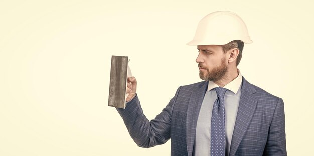 confident-businessman-man-suit-safety-helmet-hold-plaster-trowel-isolated-white-copy-space-plasterer_545934-6800