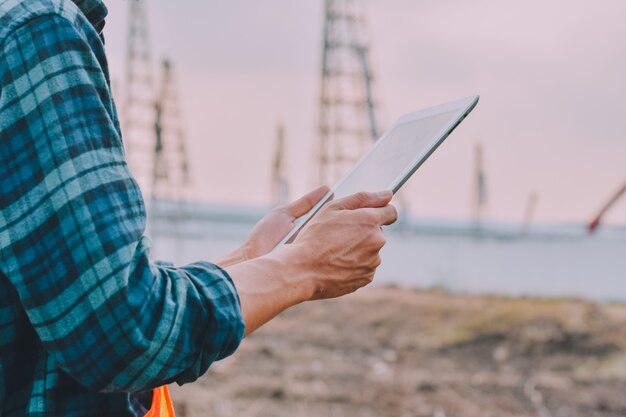 engineer-holding-tablet-working-inspection-building-construction_10541-1560