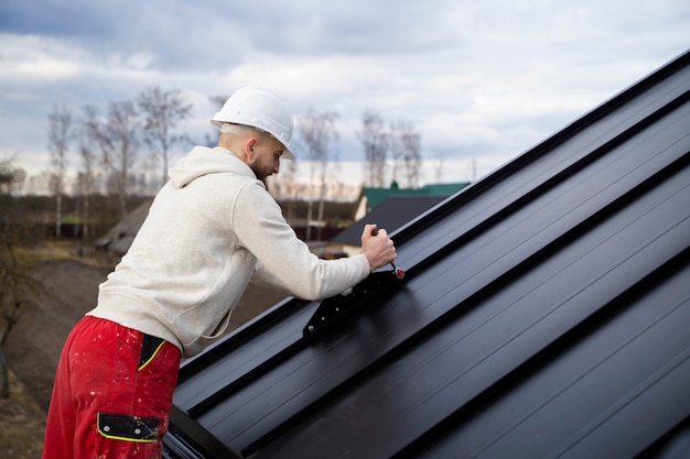 man-working-roof-medium-shot_23-2149343657