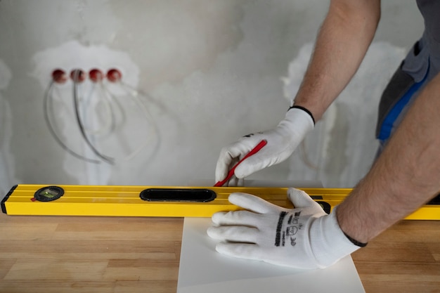 tiler-working-renovation-apartment_23-2149278564