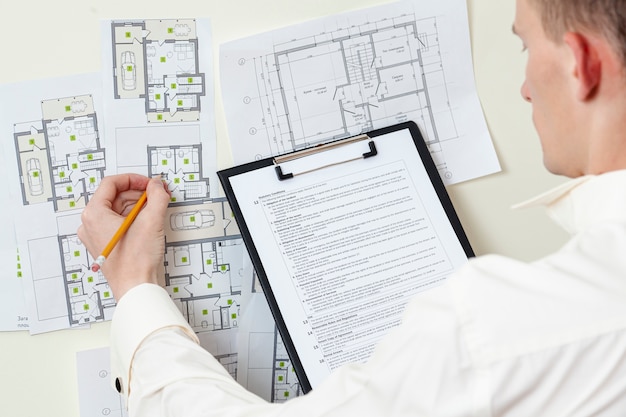 top-view-architect-working-house-project_23-2148346290