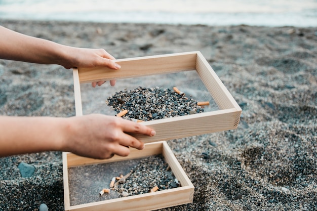 volunteer-beach-concept-with-cigarettes_23-2147827085