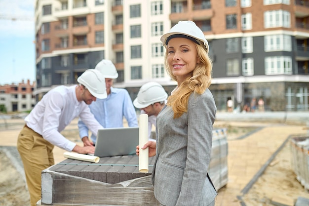 woman-with-drawing-men-with-laptop-outdoors_259150-57840